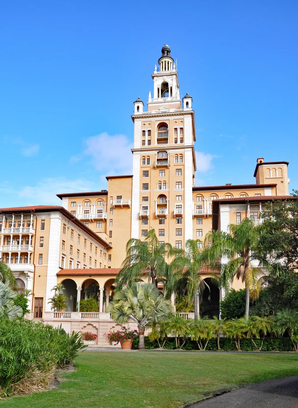 The Biltmore Hotel tower framed by palms in Coral Gables